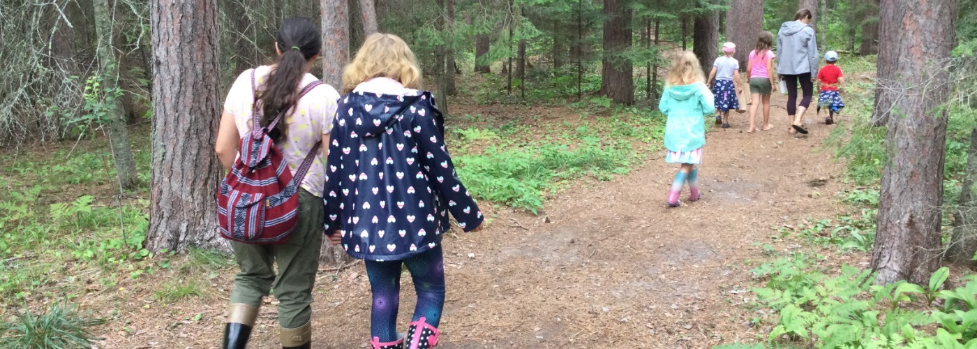 Families walking on a nature trail